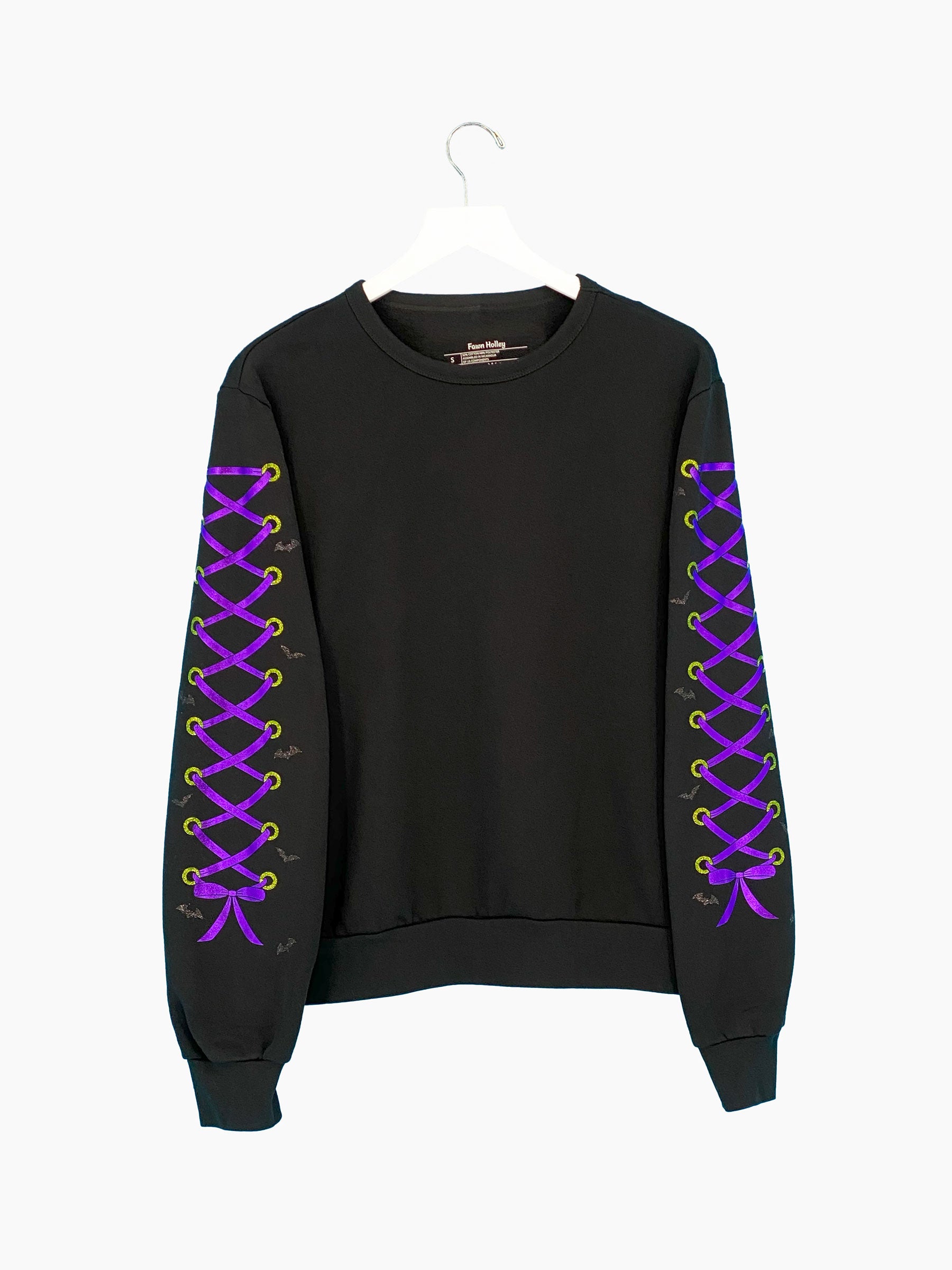 Black sweatshirt, purple metallic lace-up designs on both sleeves, glitter green grommets and black bats.