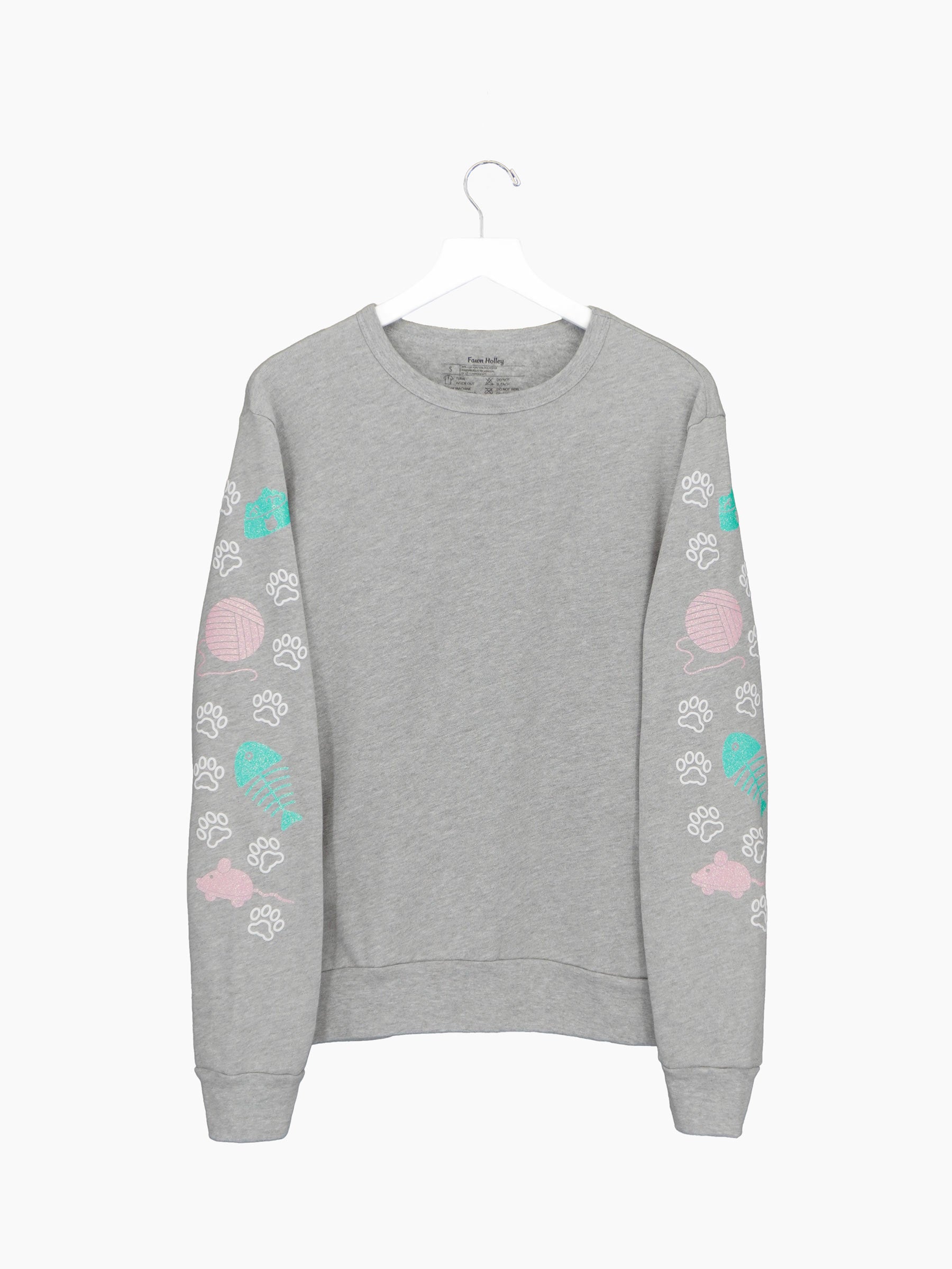Grey crewneck with white cat paw tracks on both sleeves with glittery pink, mint cat related designs.